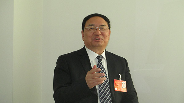 建立完善环境司法制度刻不容缓—专访全国人大代表梁明远